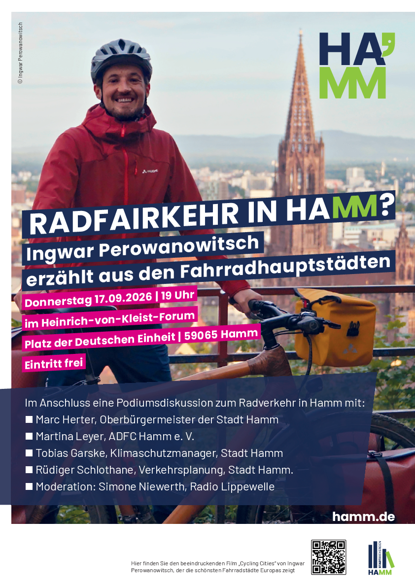 Werbeplakat Radfairkehr in Hamm. Ingwar Perowanowitsch mit dem Fahrrad auf einer Br&uuml;cke mit der Kulisse von Freiburg im Hintergrund.